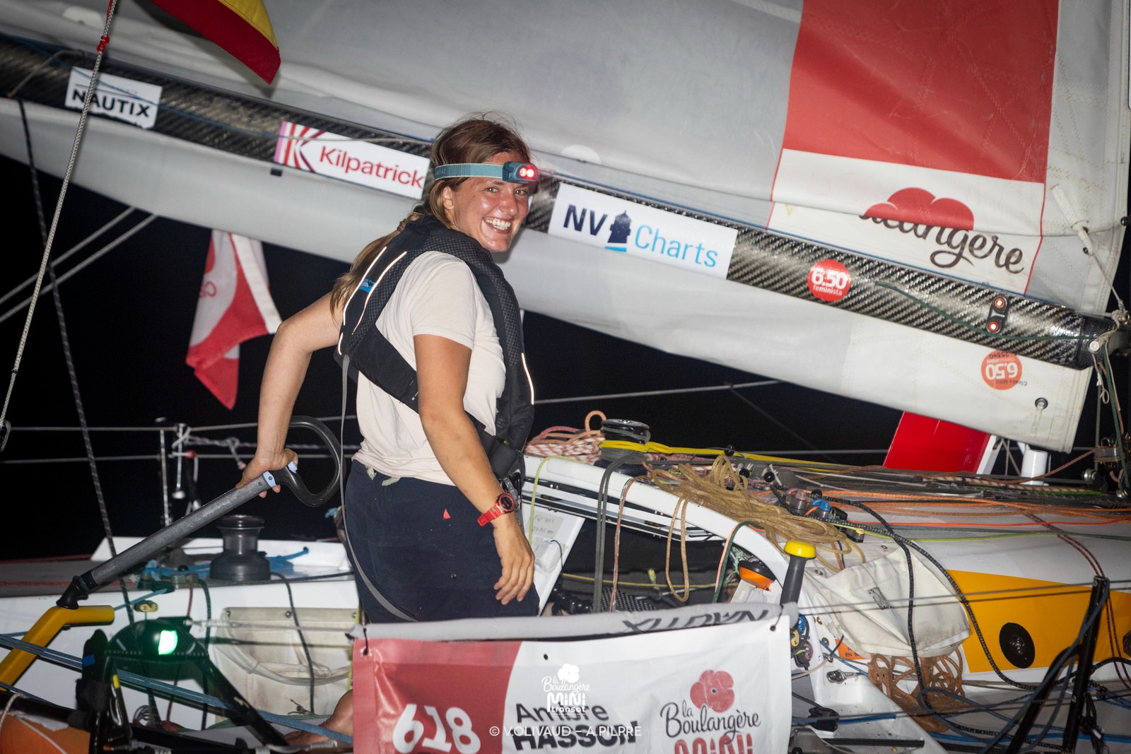 Ambre Hasson smiling onboard a racing boat at night