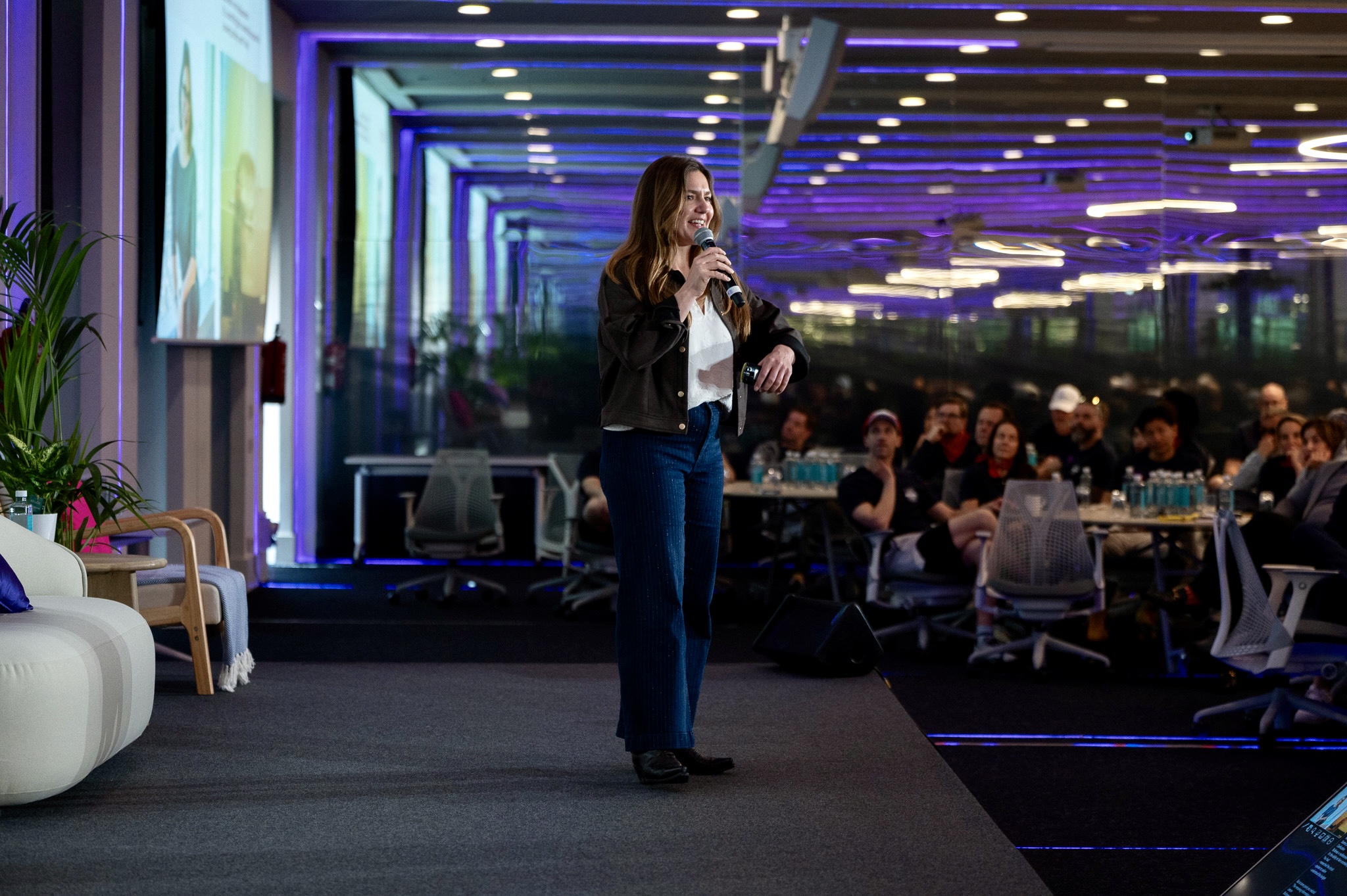 Ambre Hasson speaking to a live corporate audience